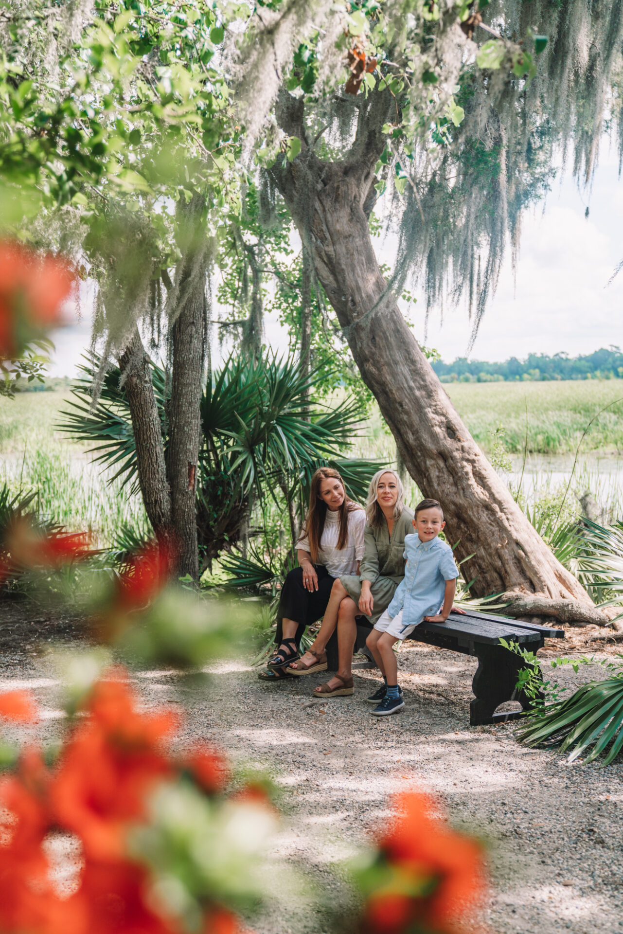 family sorrounded by charleston blossoms