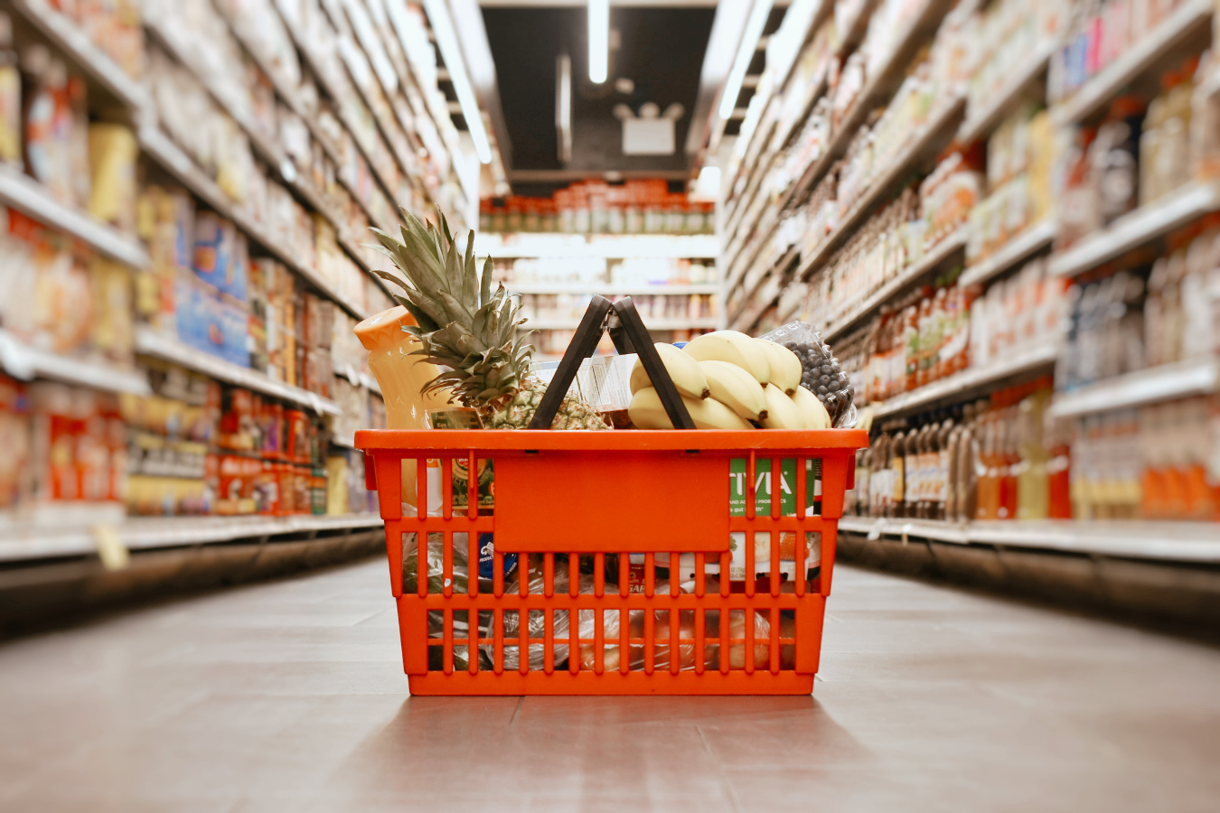 orange grocery cart with shoppings inside
