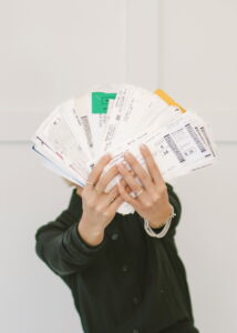 ands holding a passport with visas and entry stamps as proof of extensive international travel experience.