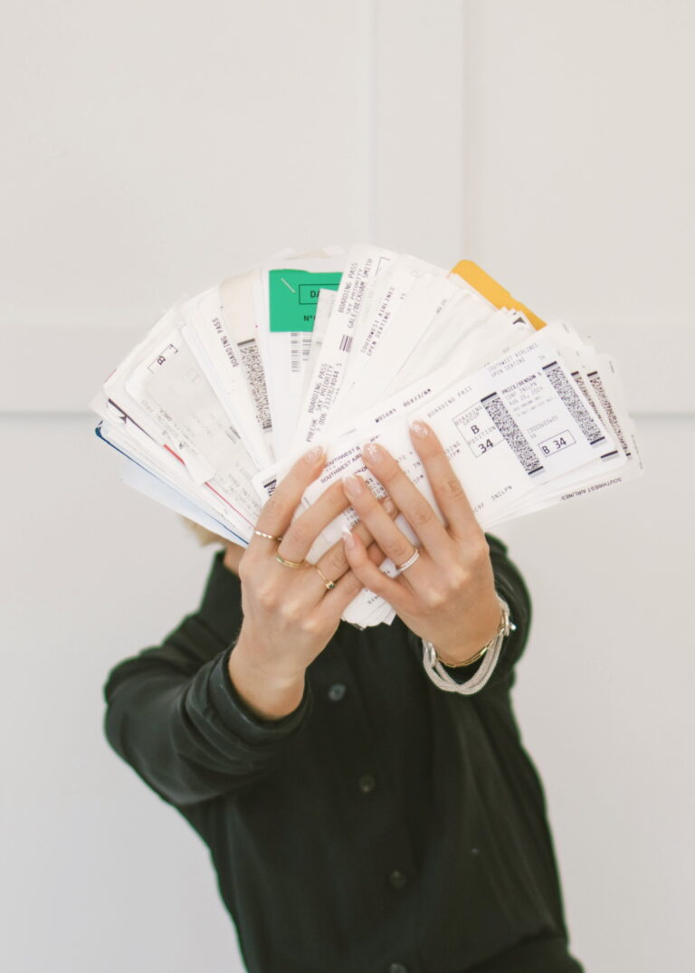 ands holding a passport with visas and entry stamps as proof of extensive international travel experience.